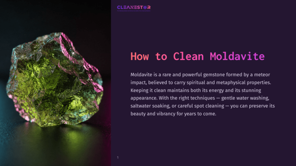 1 How To Clean Moldavite Close-Up Of A Rough, Translucent Green Moldavite Gemstone With Pink And Purple Light Reflections, Set Against A Dark, Textured Background. Text Overlay Reads &Quot;How To Clean Moldavite&Quot;.