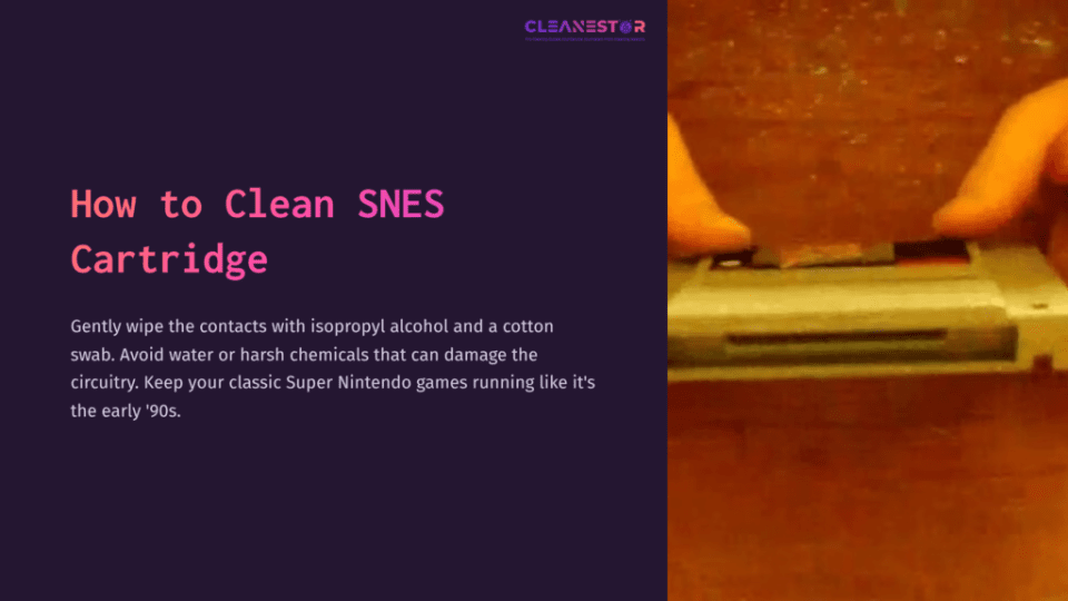 1 How To Clean Snes Cartridge A Hand Holding A Gray Snes Cartridge Against A Wooden Surface, With A Cotton Swab Nearby, Suggesting Cleaning Action.