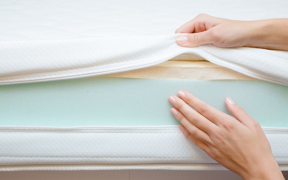 Woman Showing Foam In Mattress How To Clean Foam Mats